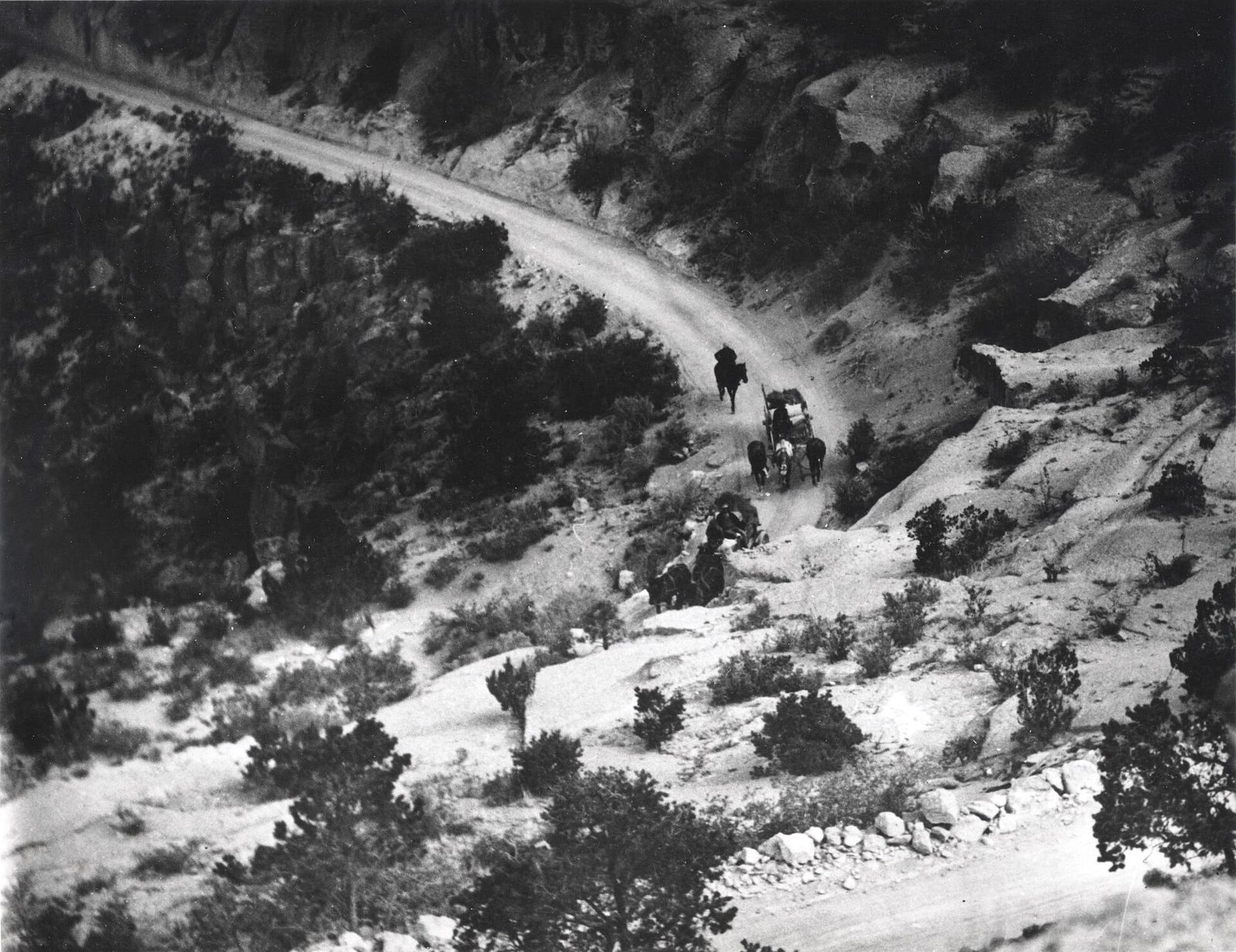 Historic photograph of a road winding up the mesa toward Los Alamos, New Mexico, during the war years